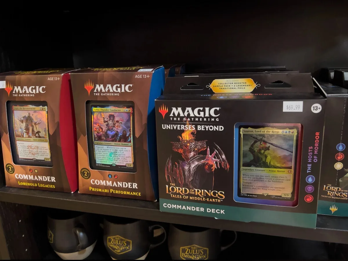Sealed Magic: The Gathering Lord of the Rings Commander decks on a store shelf